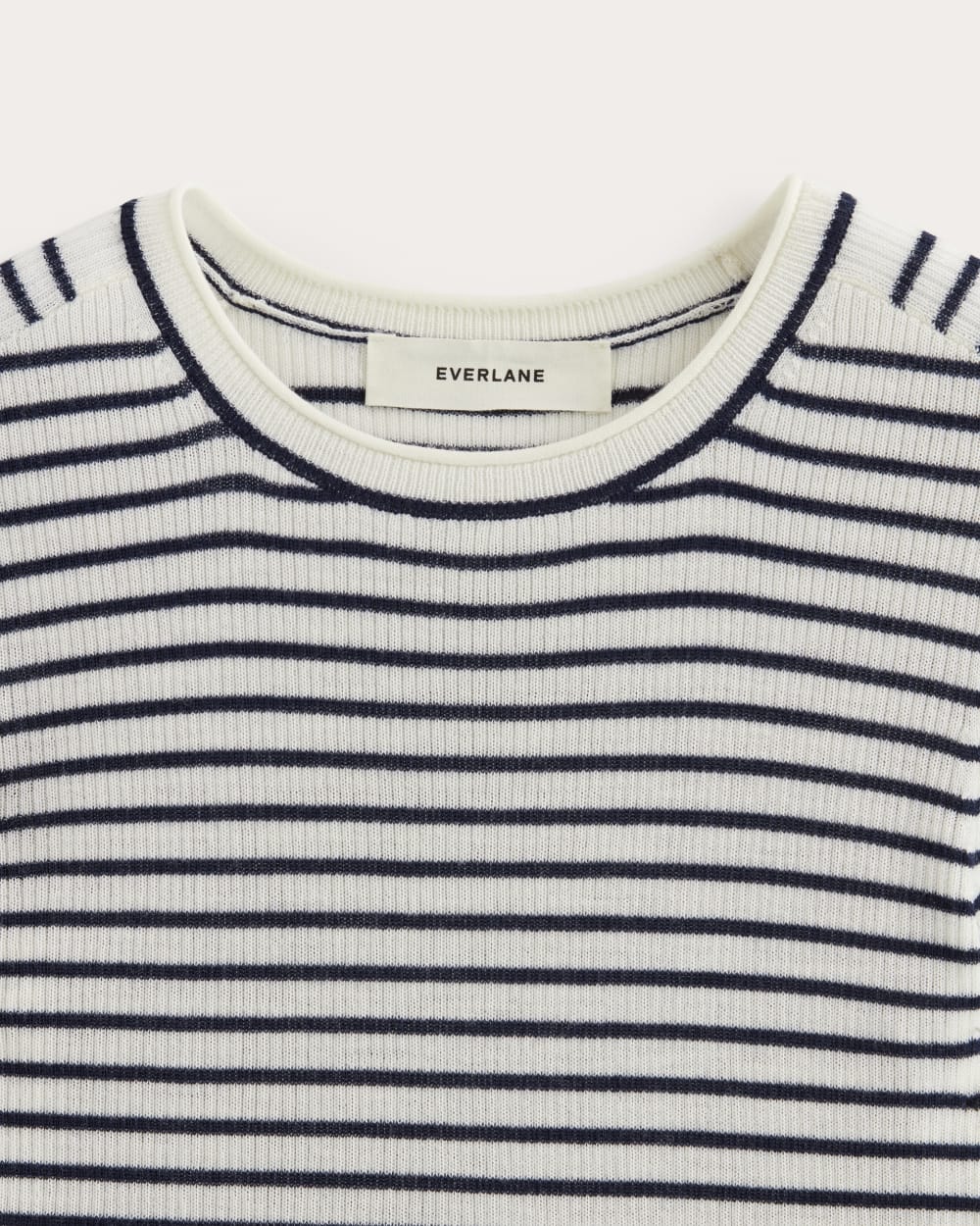 The Sweater Tee in Ultrasoft Merino in Bone/Navy — detail view