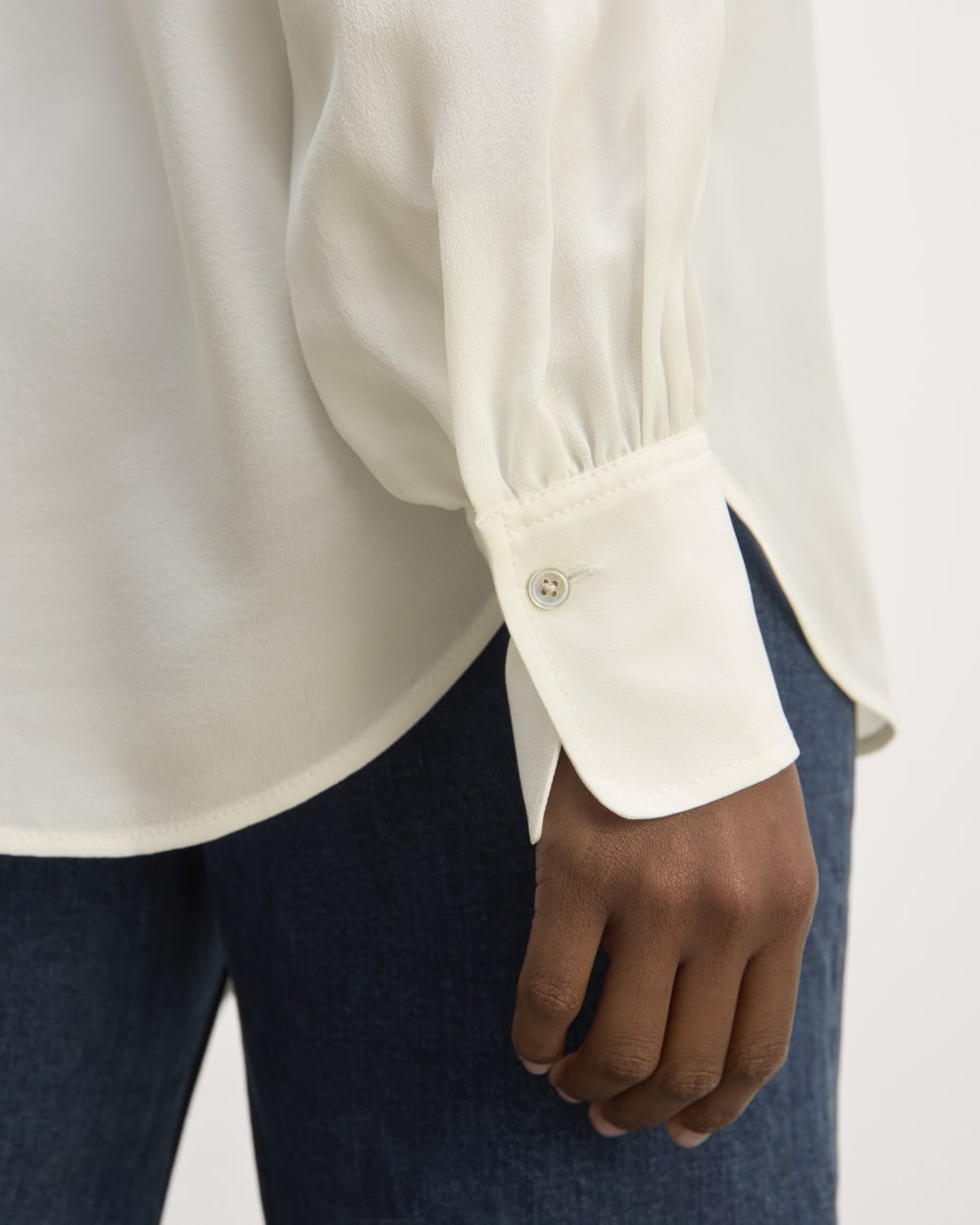 The Henley Shirt in Washable Silk in Off-White — detail view
