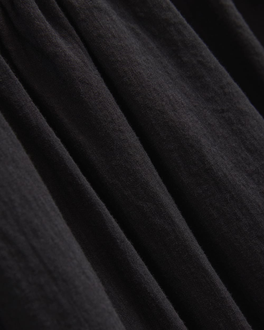 Gauze Smocked Mini Dress in Black — detail view