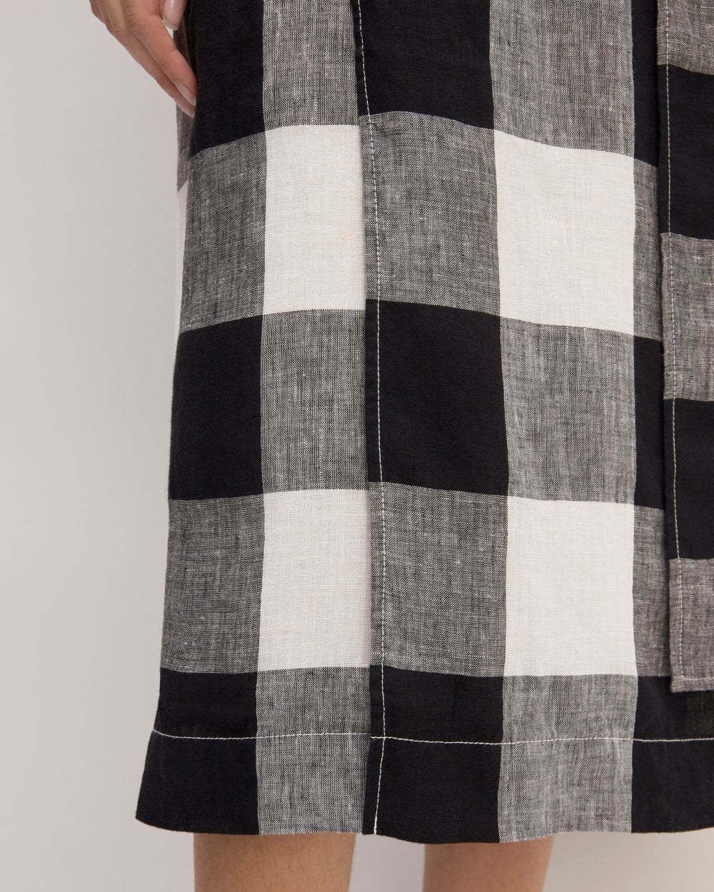 The Linen Wrap Skirt in Bone / Black Check — detail view