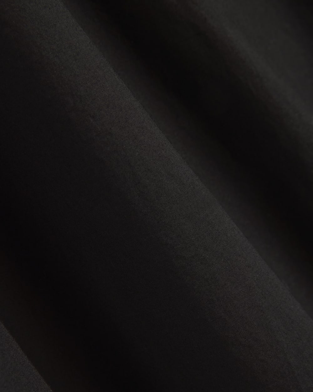 The Midi Skirt in Ultrasoft Cotton in Black — detail view