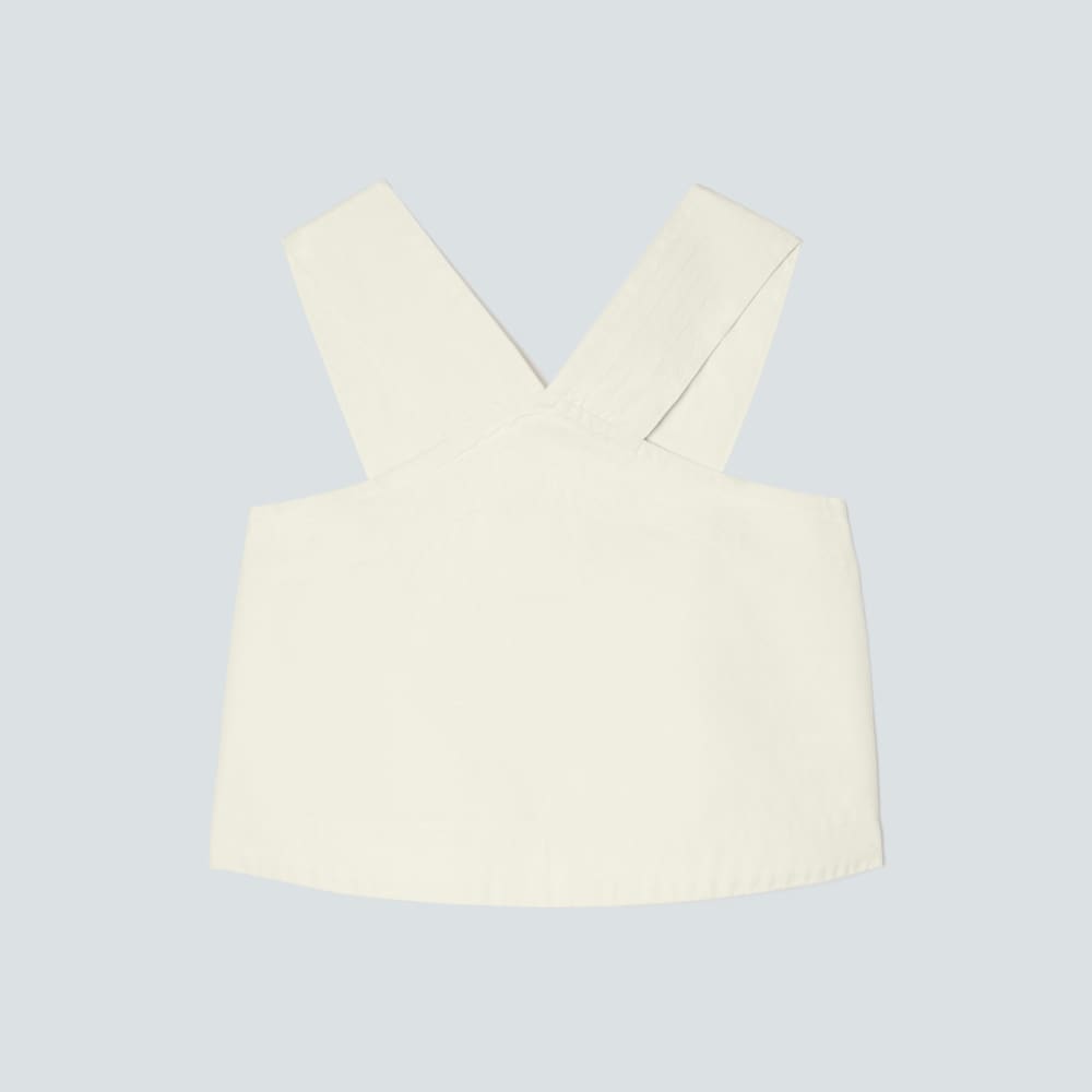 The Cross-Front Apron Top in Canvas — front view