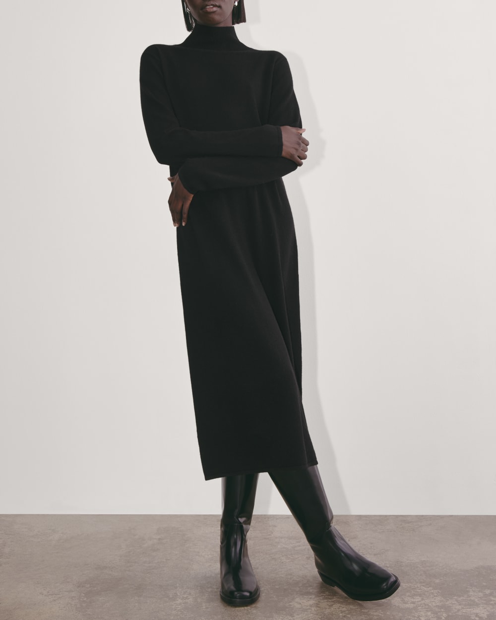 The Turtleneck Sweater Dress in Cashmere in Black — detail view