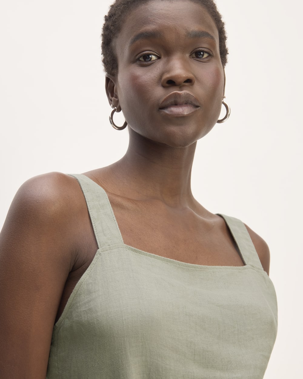 The Linen Side-Button Jumpsuit in Sage Green — detail view
