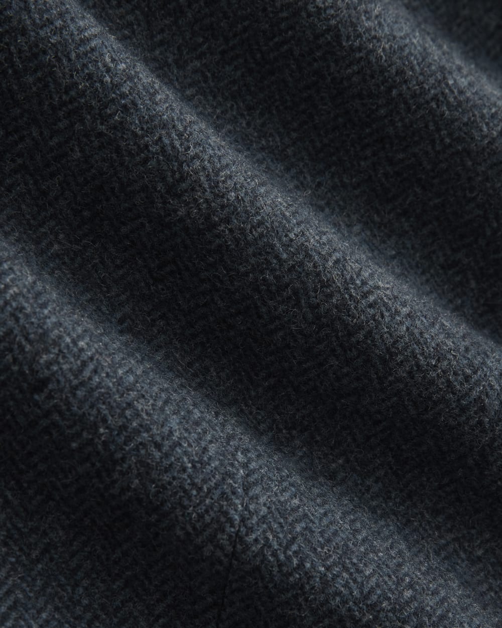 The Oversized Blazer in Wool in Navy Herringbone — detail view
