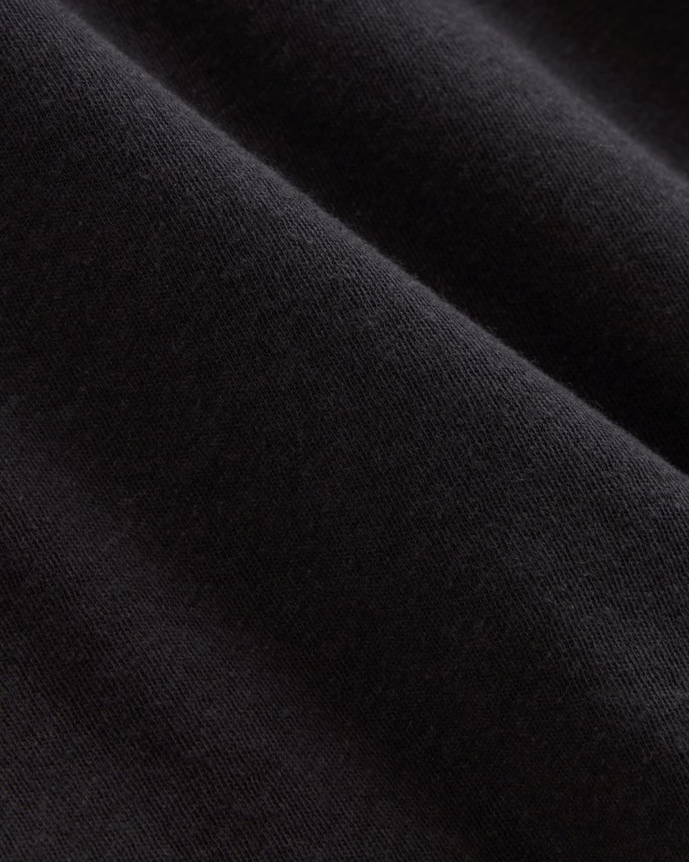 The Slouchy V-Neck Tee in Cotton Linen in Black — detail view