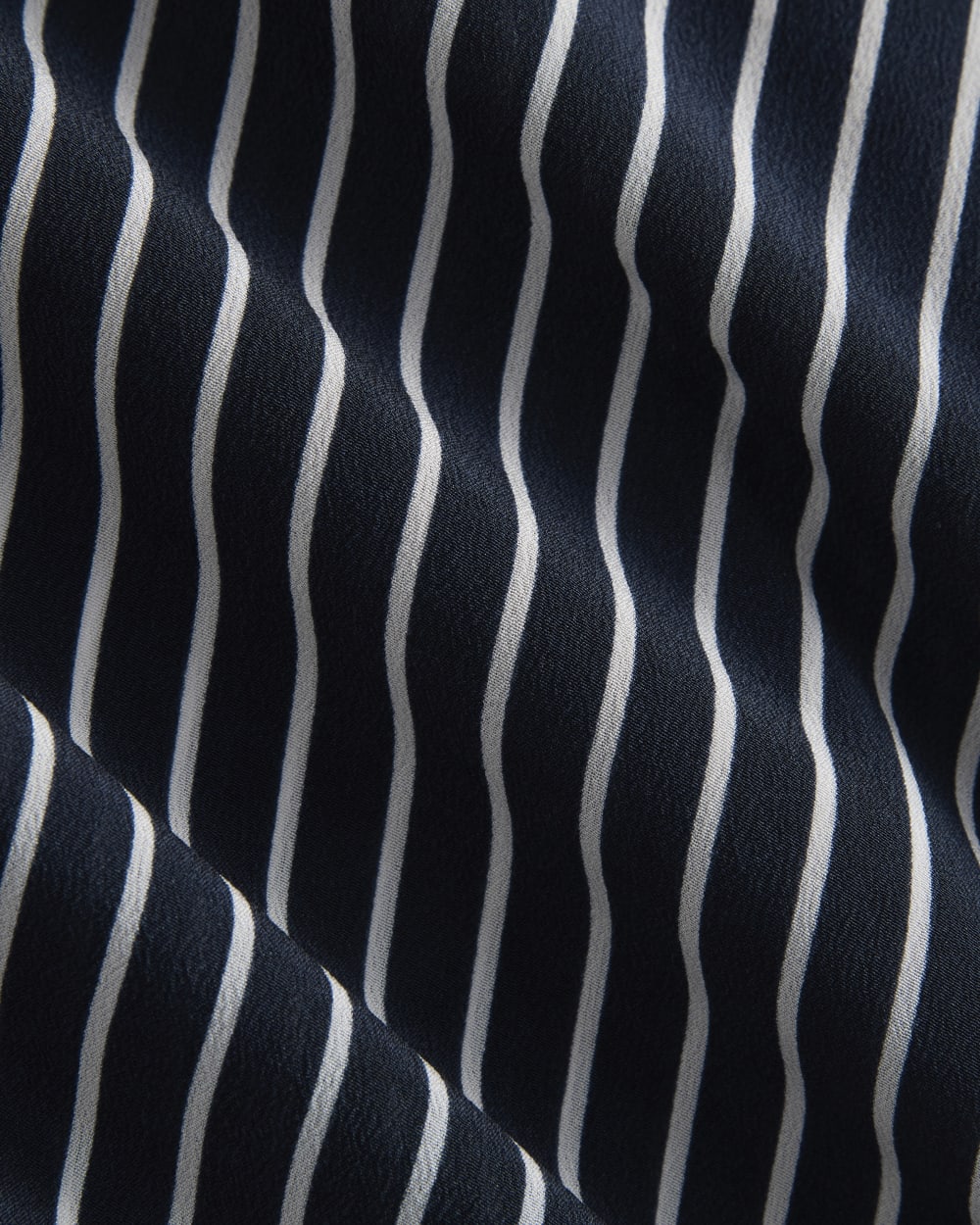 The Boxy Shirt in Washable Silk in True Navy / Bone Stripe — detail view