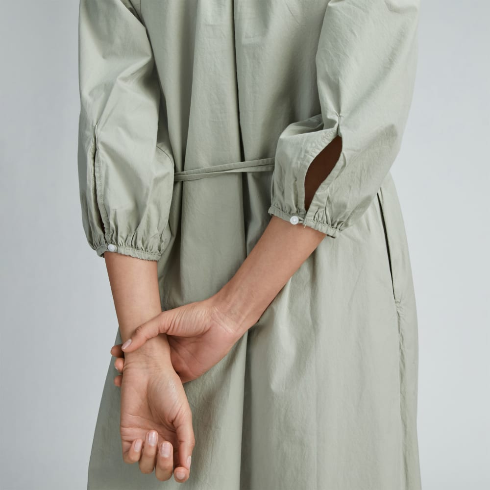 The Raglan Sleeve Poplin Dress in Seagrass — detail view