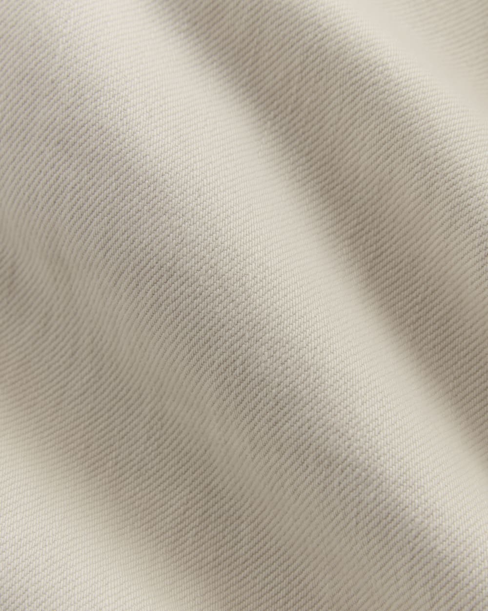 The Long Denim Barrel Jacket in Garment-Dyed Sand — detail view