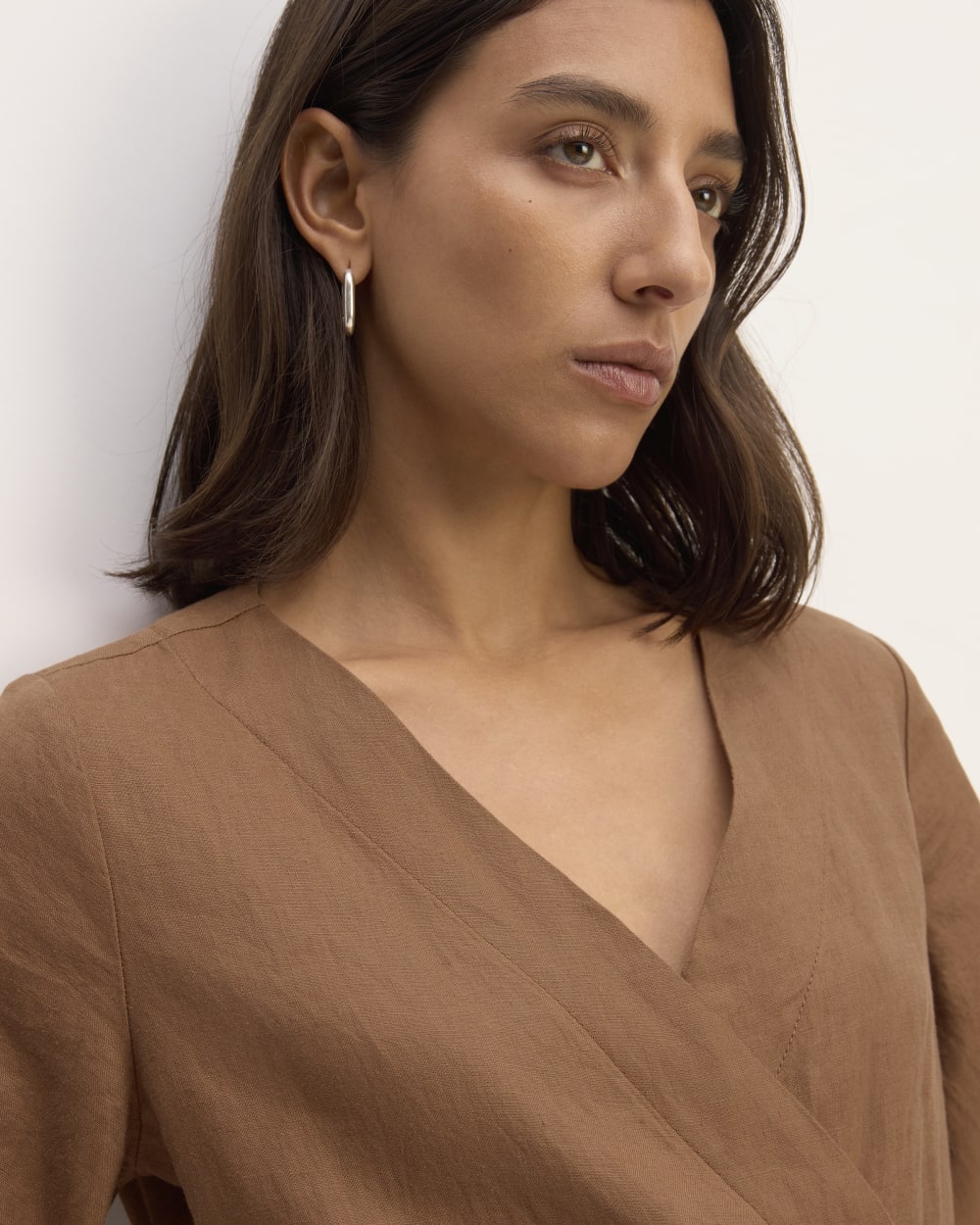 The Wrap Jumpsuit in Linen in Carob Brown — detail view