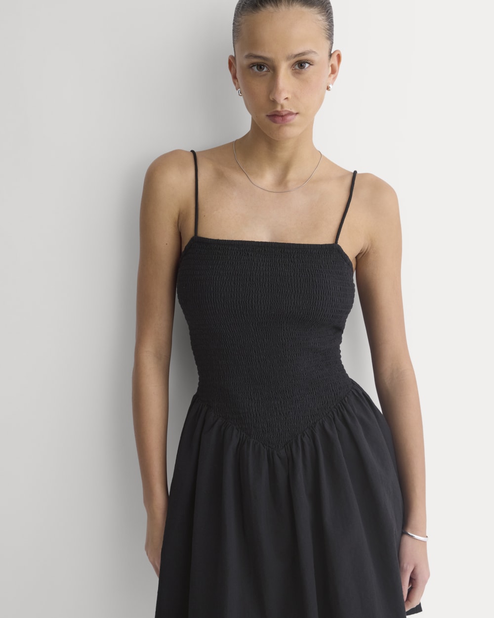 Gauze Smocked Mini Dress in Black — detail view