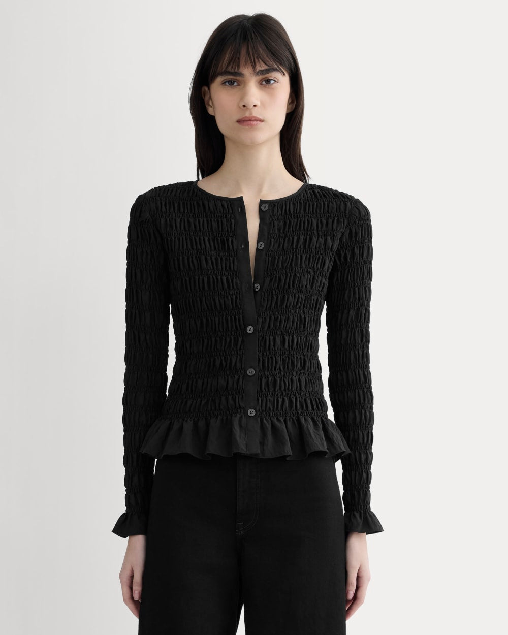 The Smocked Cardigan in Black — front view