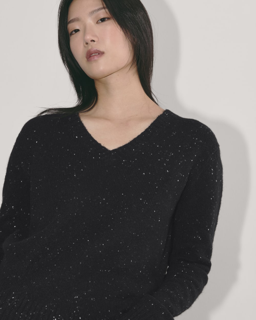 The V-Neck Sweater in Plush Cotton in Black Confetti — detail view