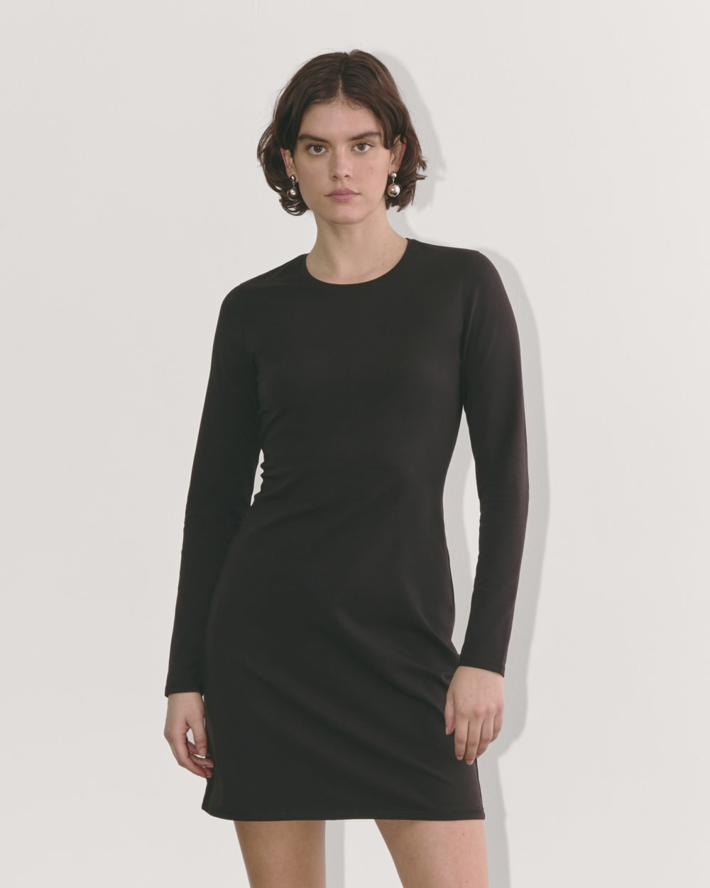 The Form Mini Dress in Black — front view