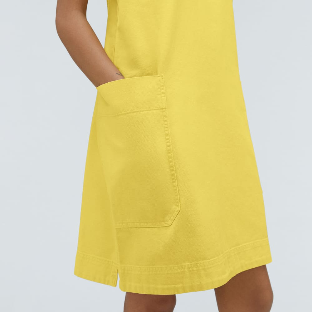 The Cross-Back Apron Mini Dress in Lemon — detail view