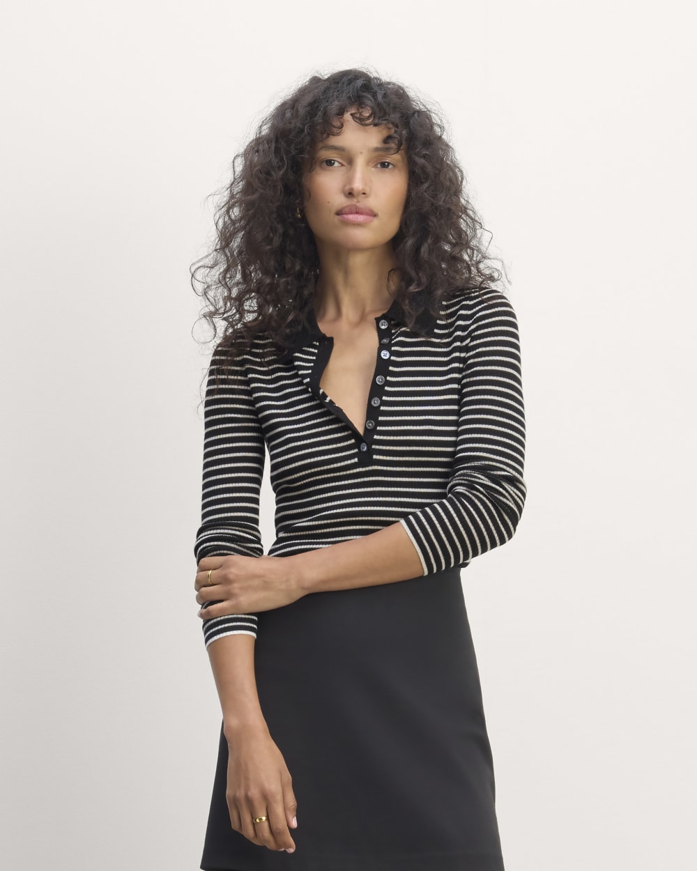 The Polo in Ultrasoft Merino in Black / Bone — front view