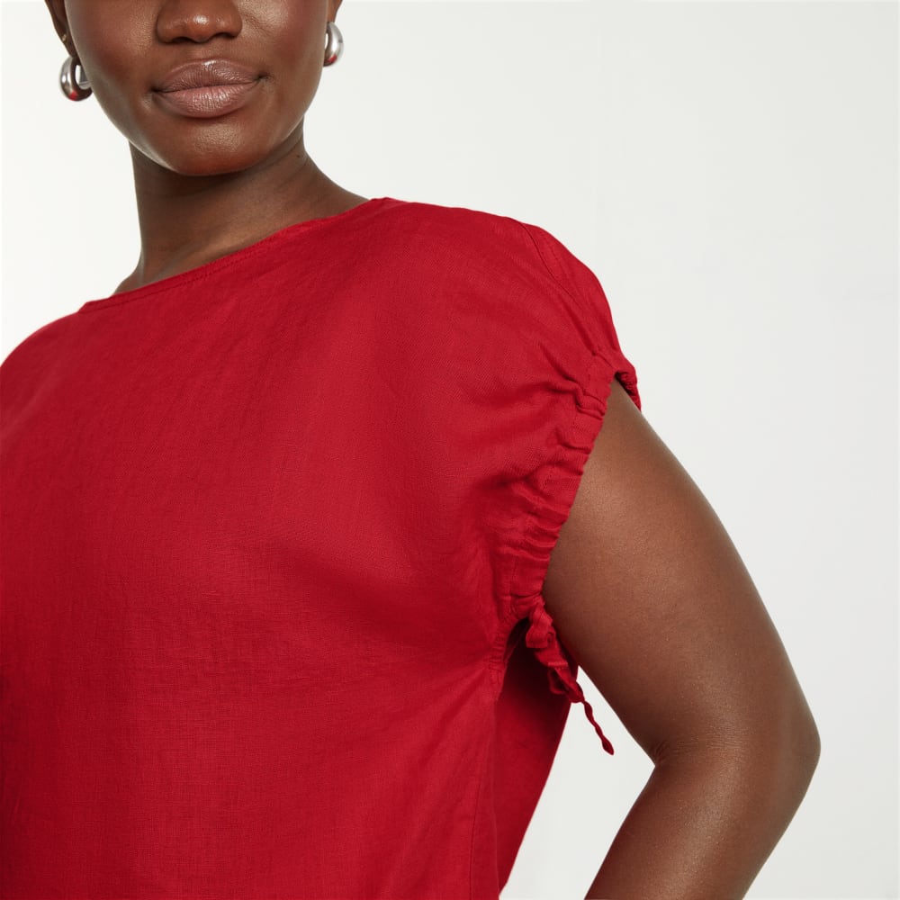 The Drawstring Tunic in Goji Berry — detail view