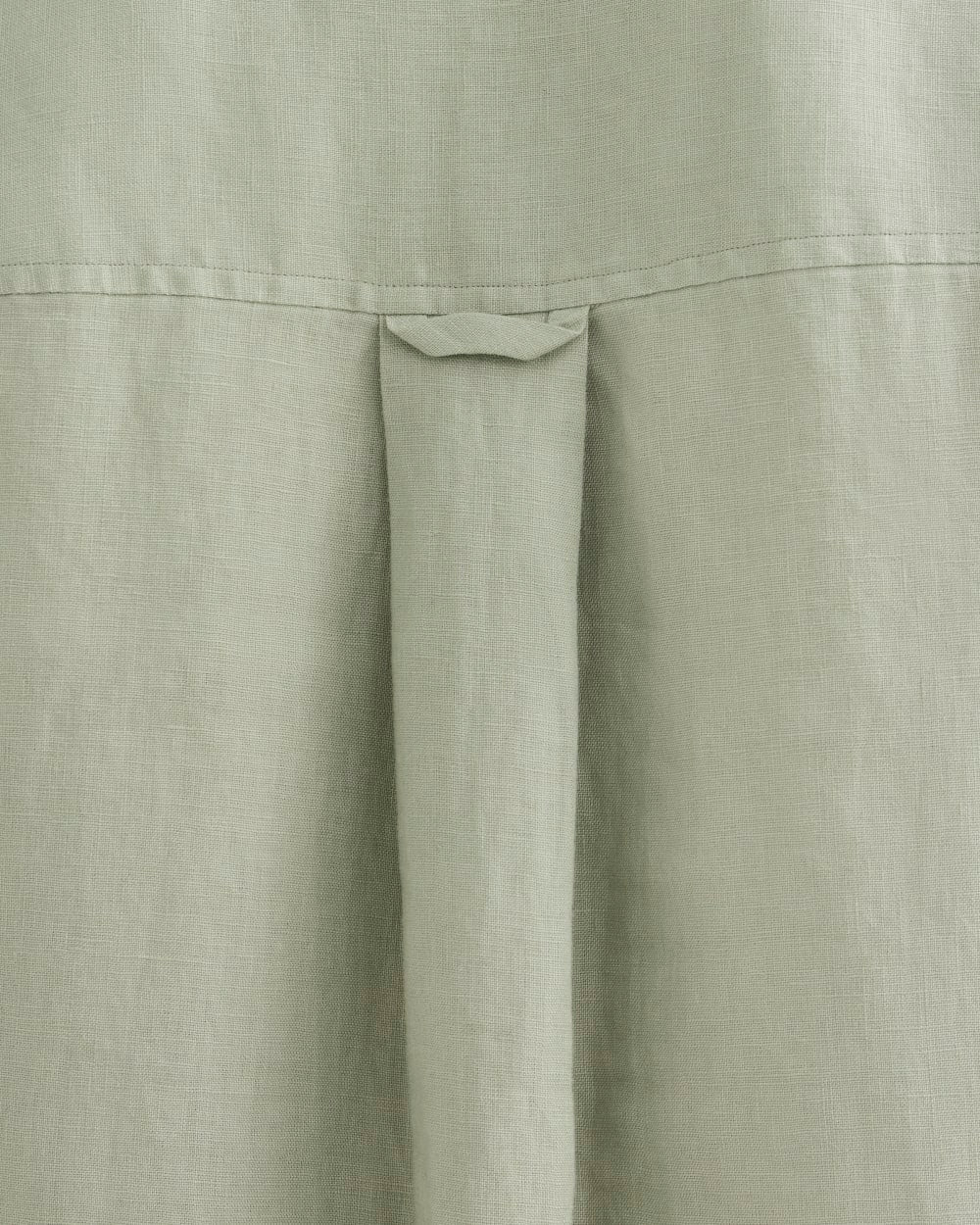 The Daytripper Dress in Linen in Seagrass — detail view