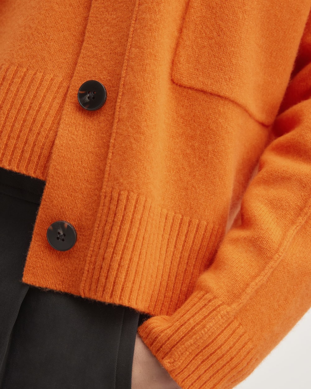 The Good Merino Wool Cardigan in Orange — detail view