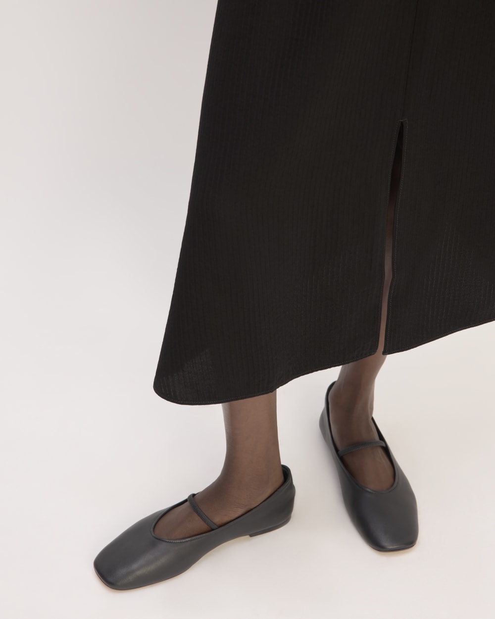 The Mini Jacquard Stripe Slip Skirt in Black — detail view