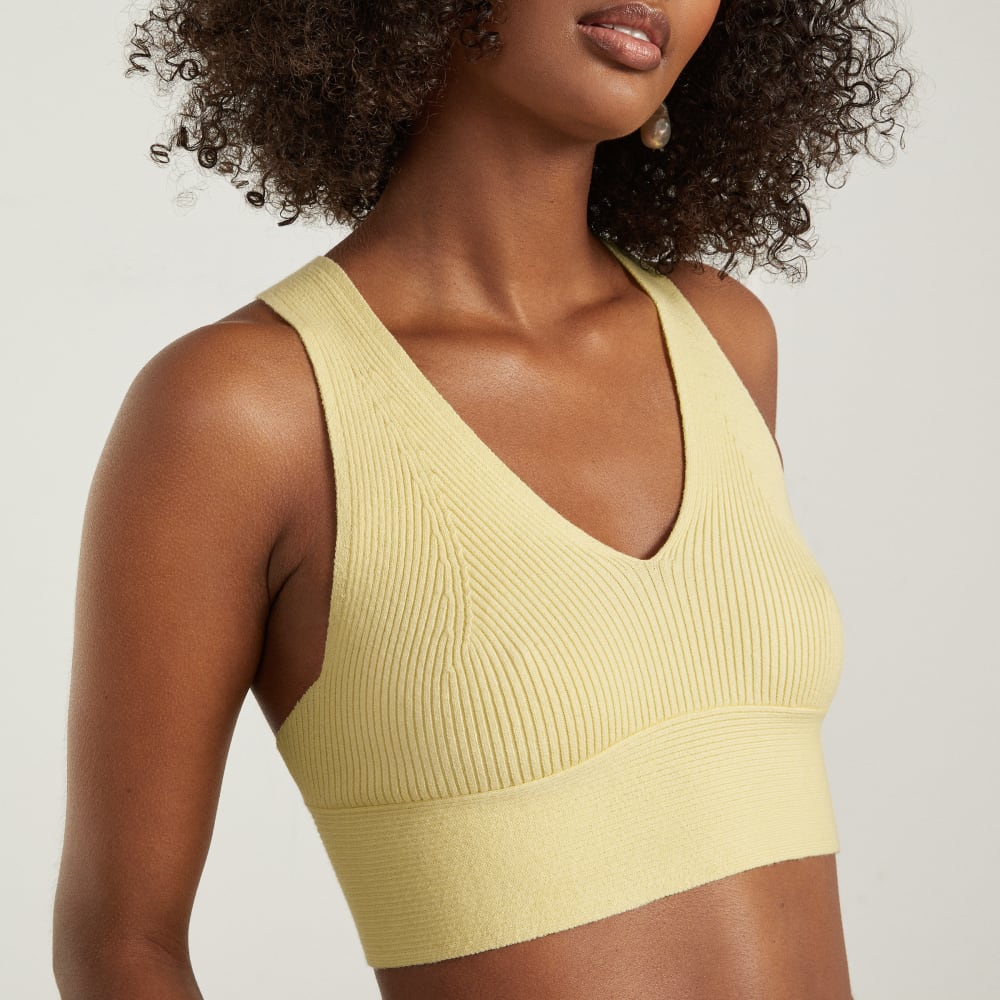 The Cross-Back Cropped Sweater Top in Pastel Yellow — detail view