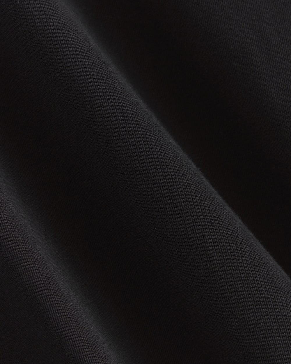 The Organic Cotton Weekend Tee Dress in Black — detail view