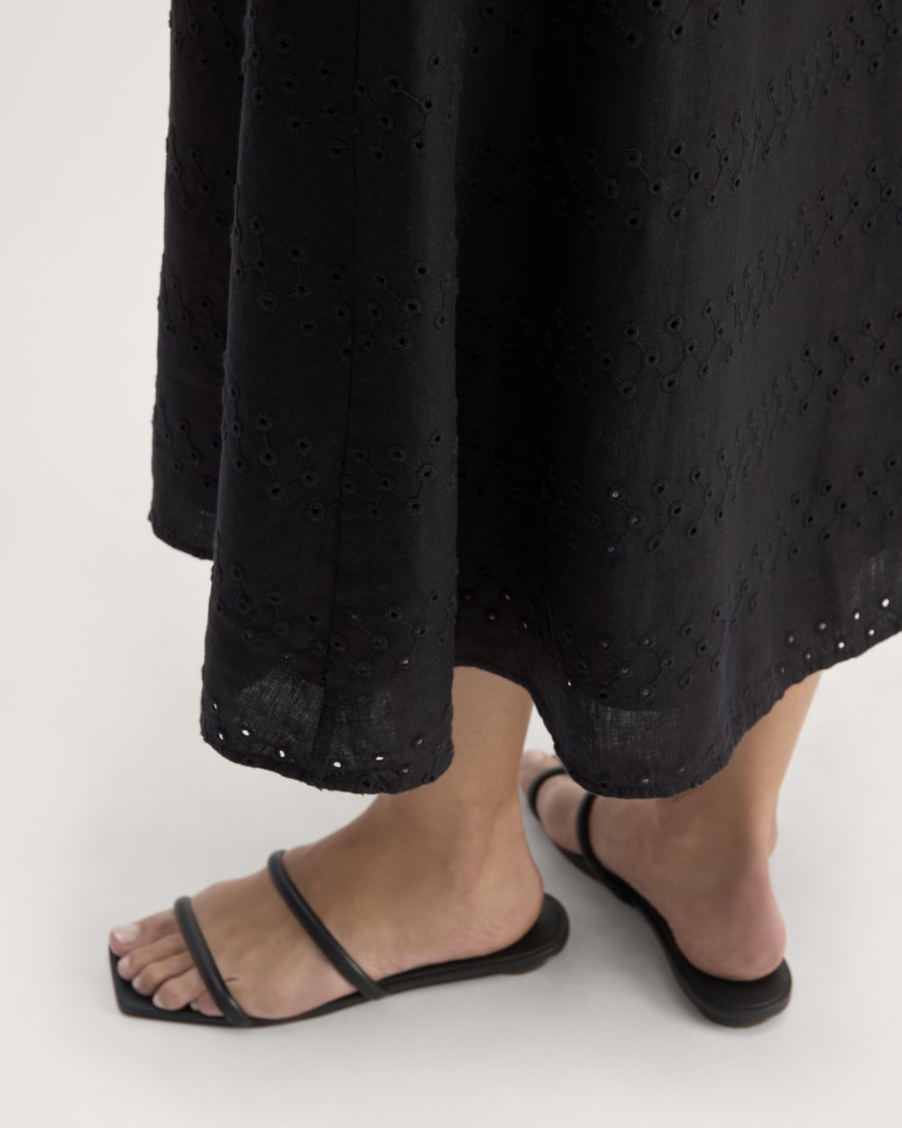 The Linen Eyelet Midi Skirt in Black Eyelet — detail view