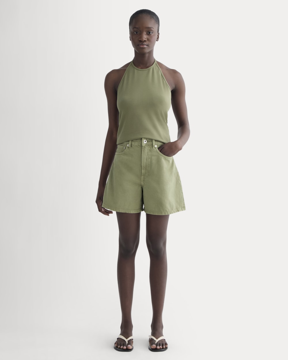 The A-Line Denim Short in Neutral Oil Green — front view