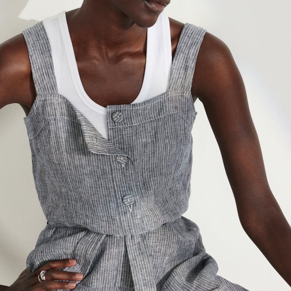 The Linen Jumpsuit in Canvas Tan / Navy — detail view