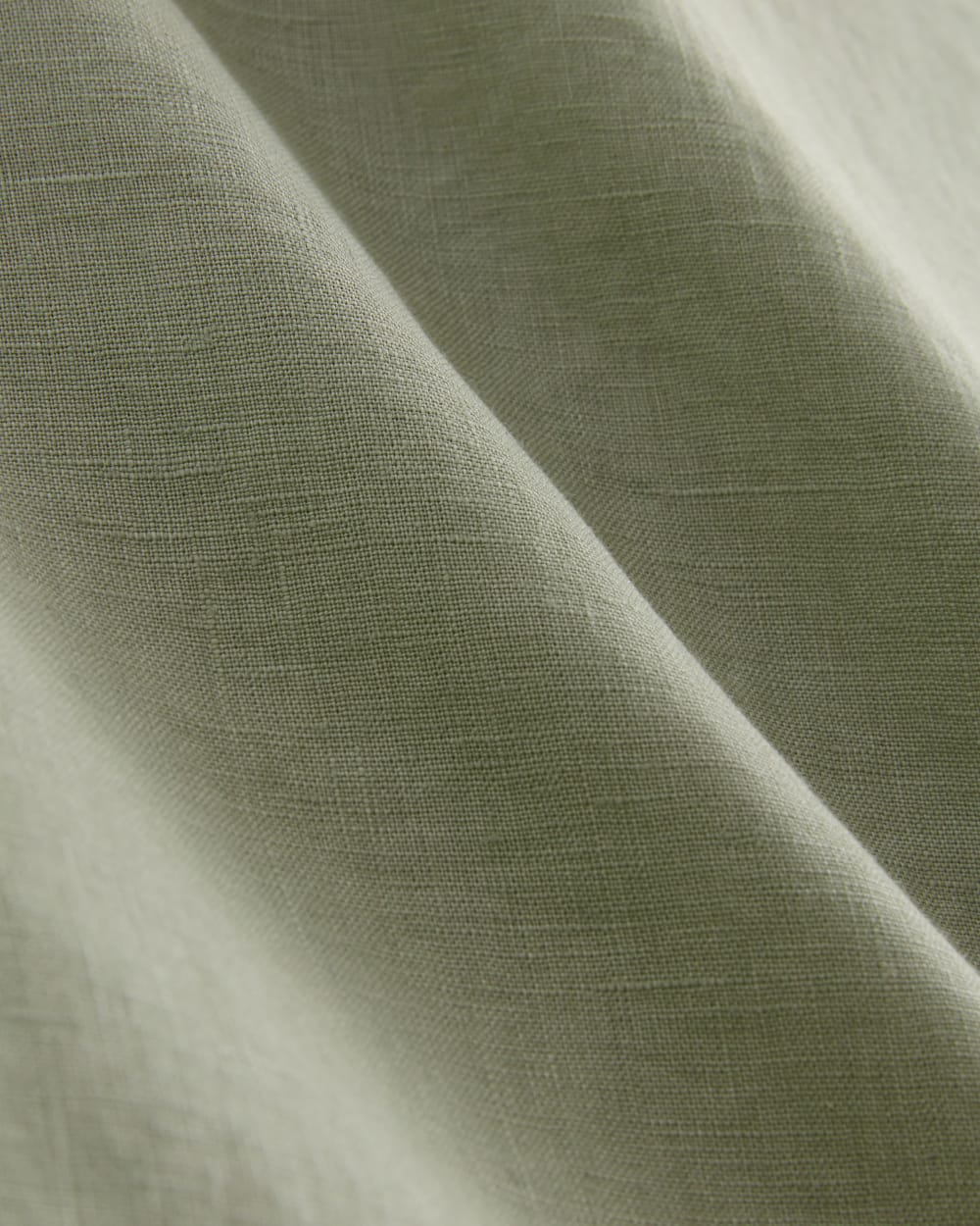The Daytripper Dress in Linen in Seagrass — detail view