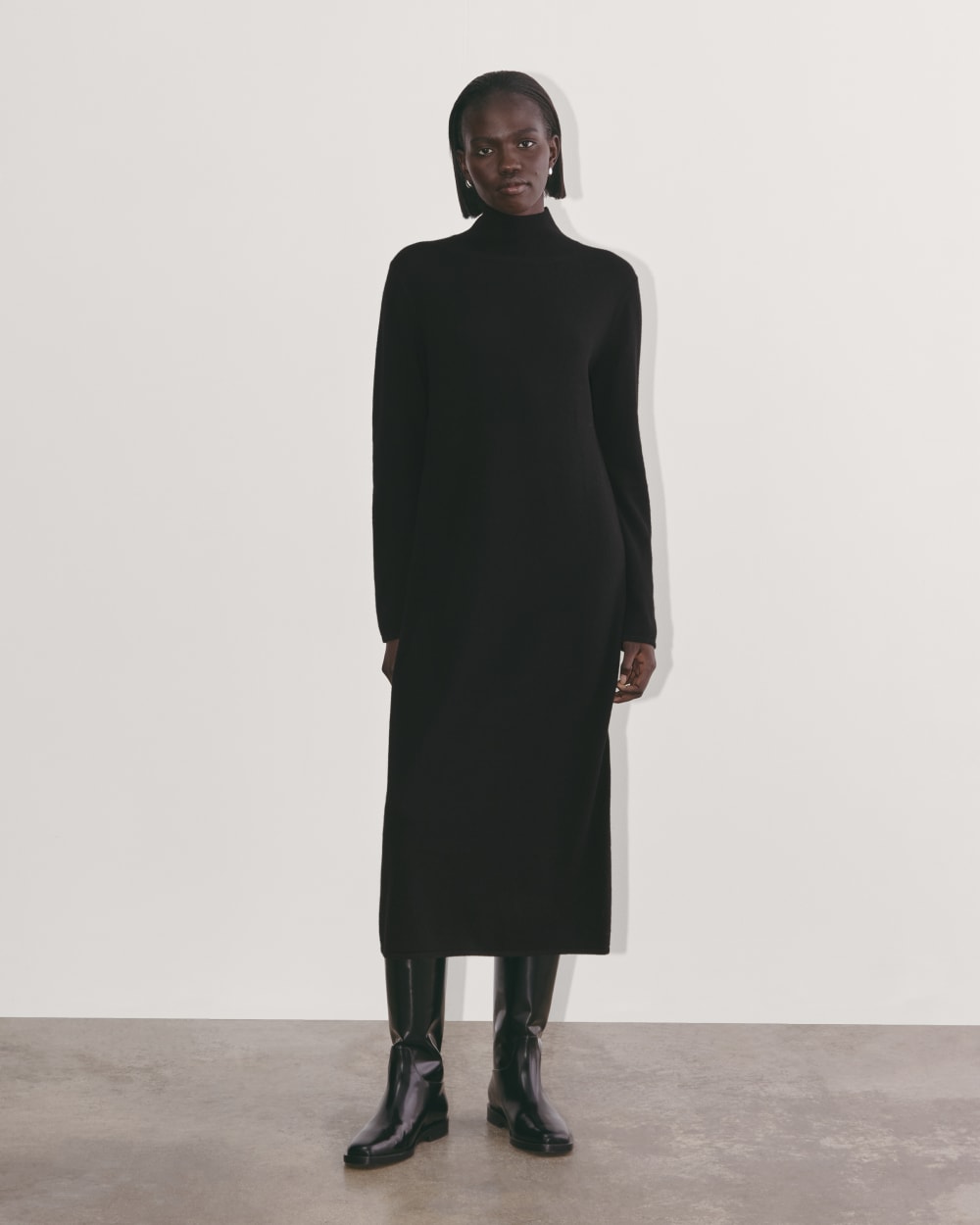 The Turtleneck Sweater Dress in Cashmere in Black — front view