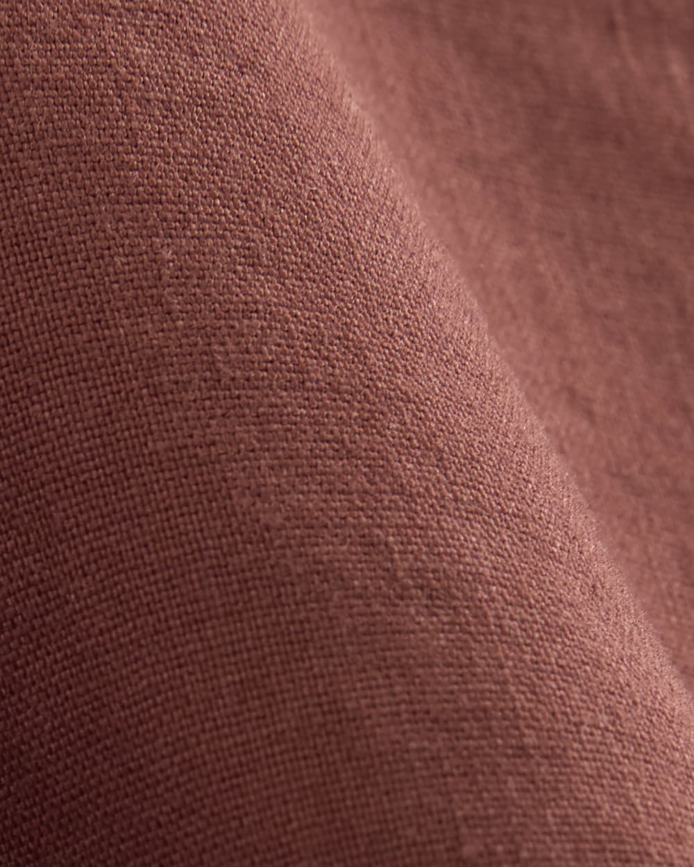 The Shift Dress in Stretch Linen in Henna Red — detail view