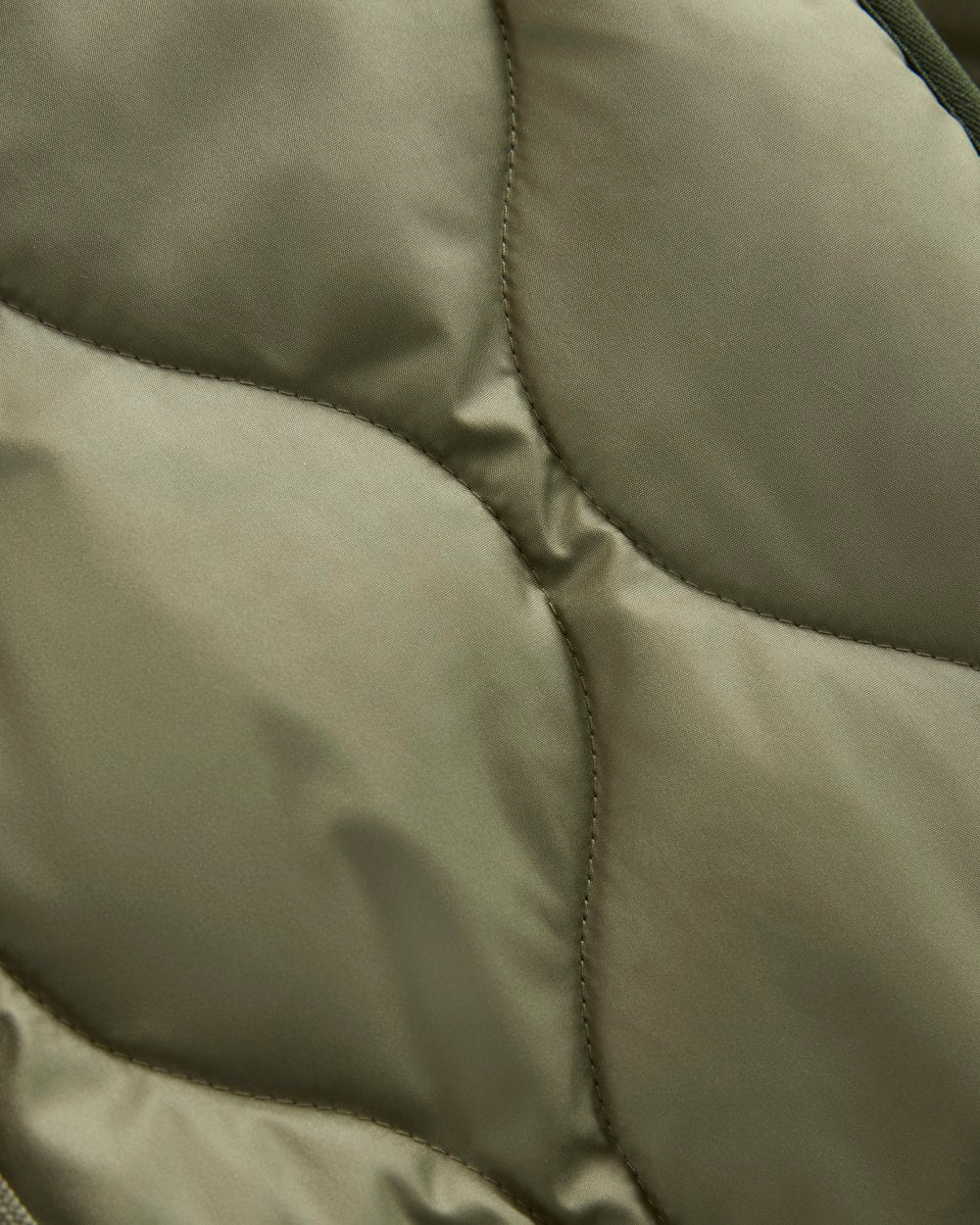 ReNew Quilted Hooded Liner in Lichen Green — detail view