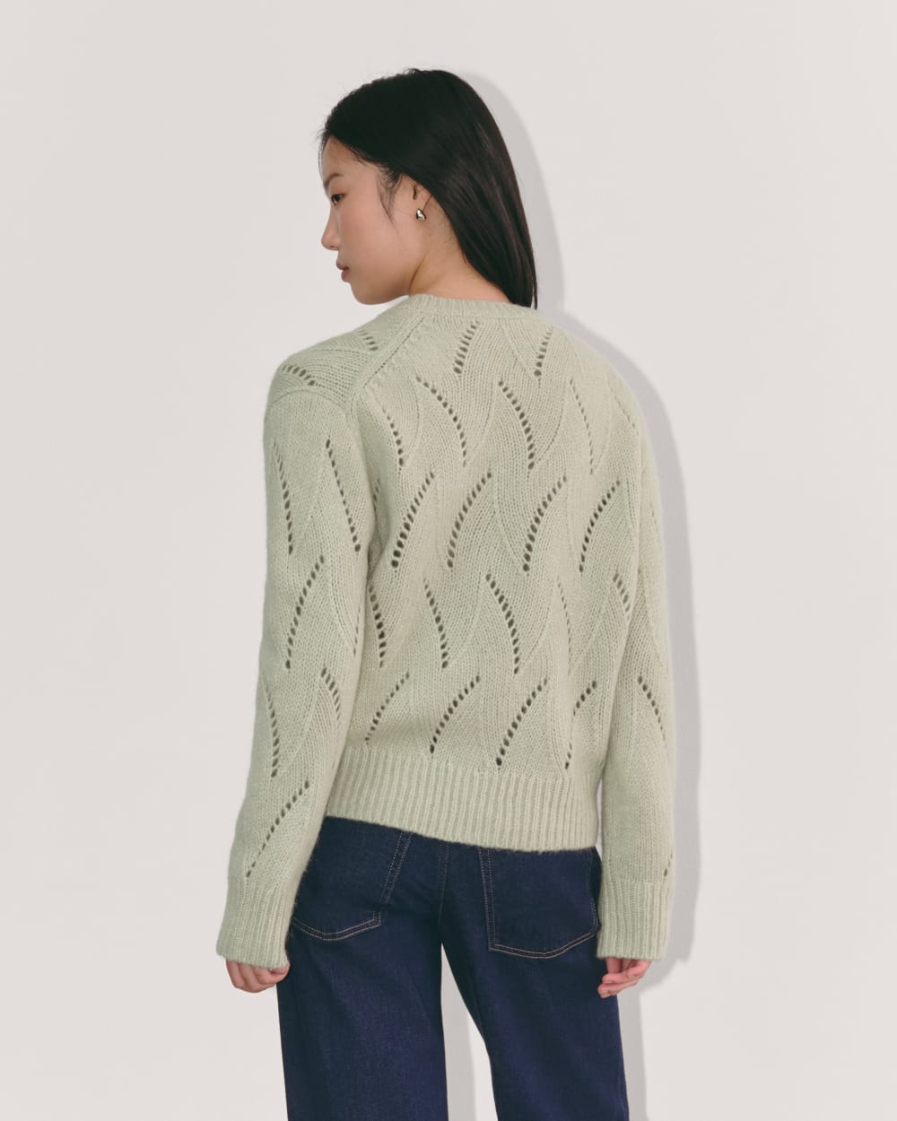 The Pointelle Sweater in Cloud in Seagrass — detail view