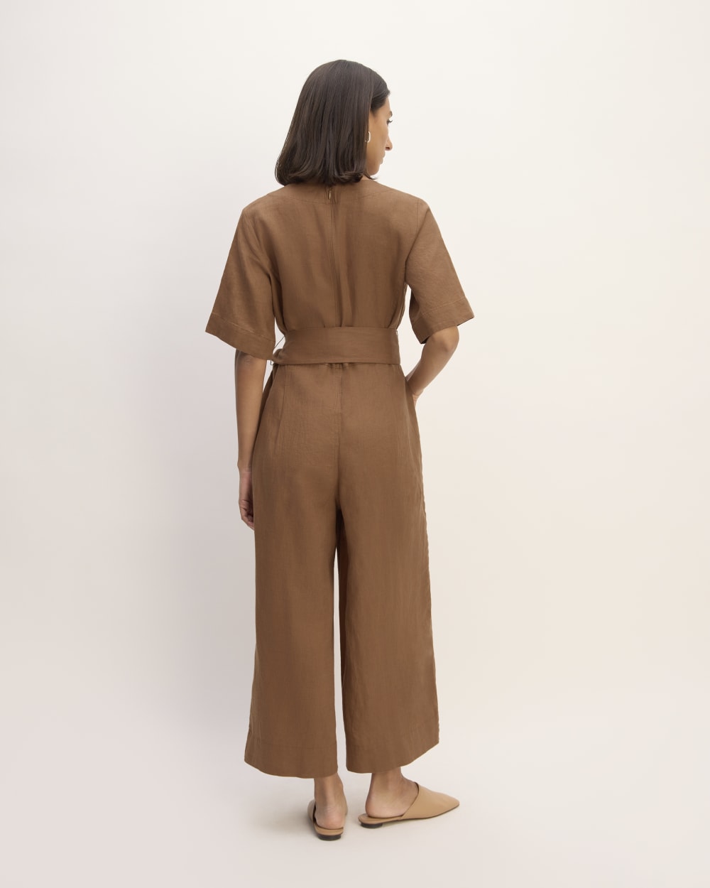 The Wrap Jumpsuit in Linen in Carob Brown — detail view