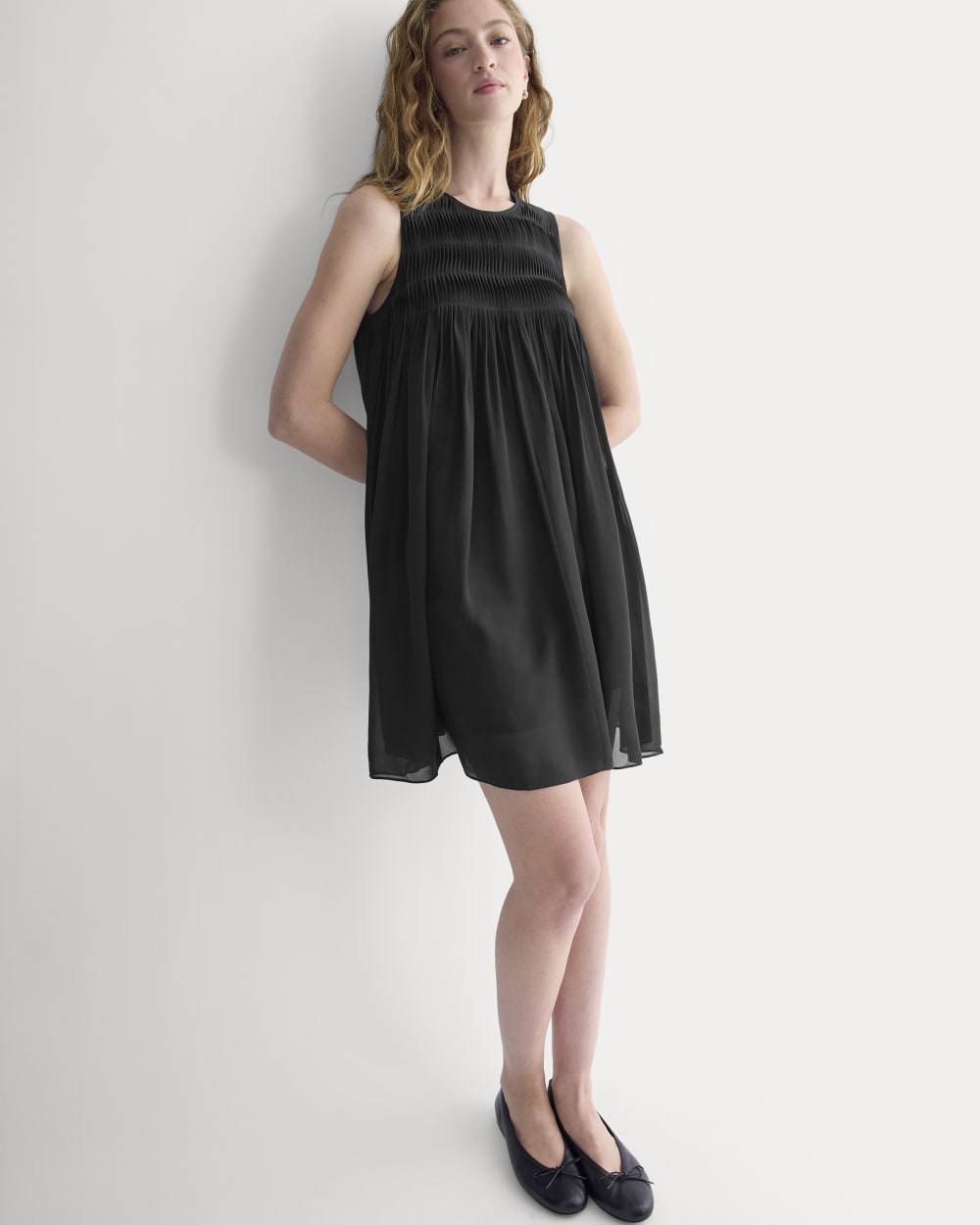 Twisted Pleated Mini Dress in Silk Georgette in Black — front view