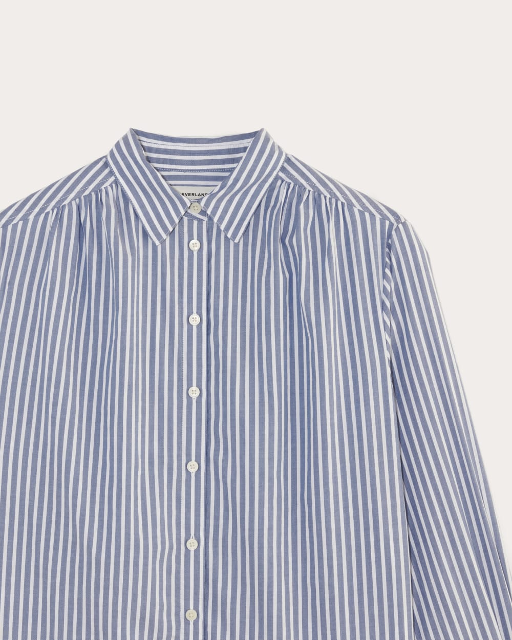 The Gathered Shirt in Silky Cotton in Bone / Mazarine Blue — detail view