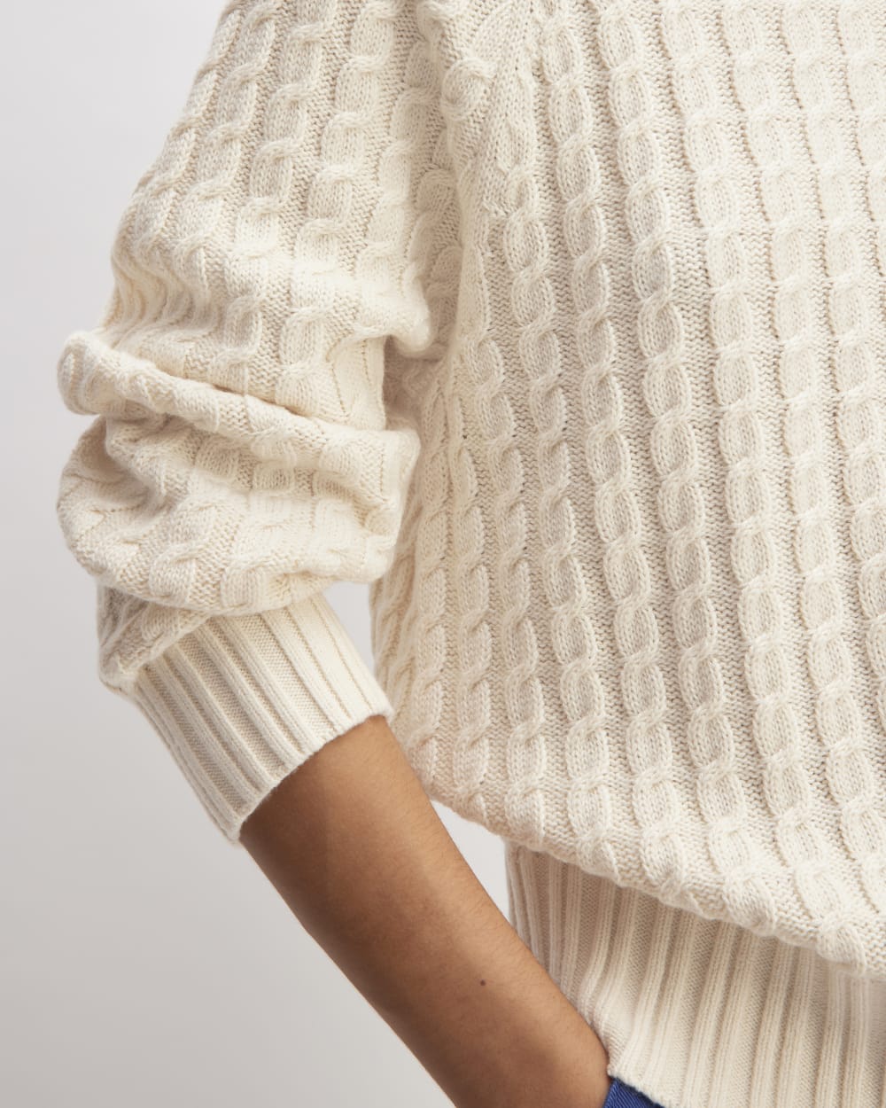 The Cotton Merino Cable Turtleneck in Canvas — detail view