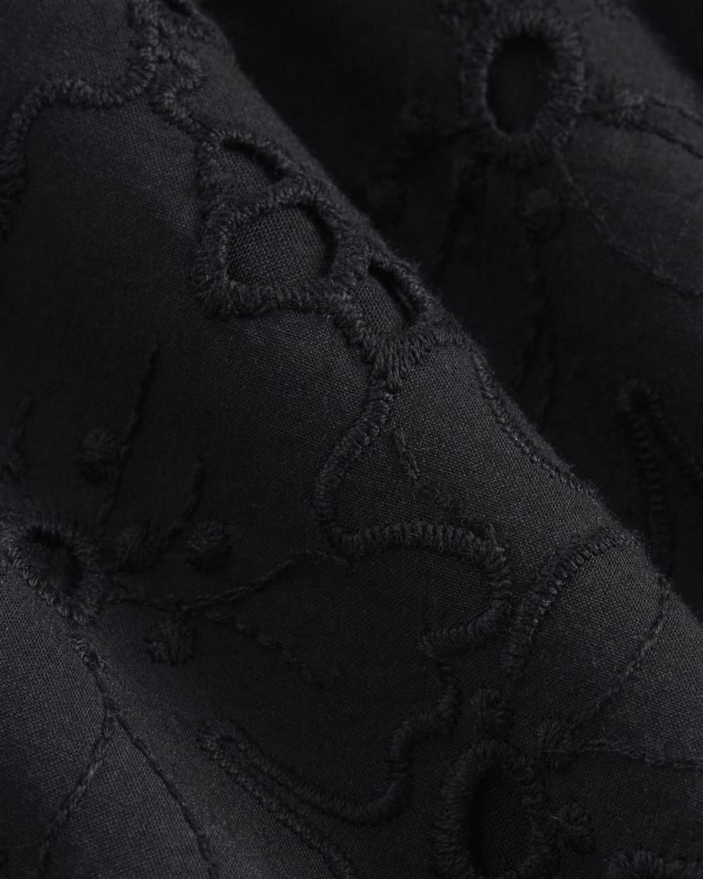 The Eyelet Pull-On Short in Black — detail view