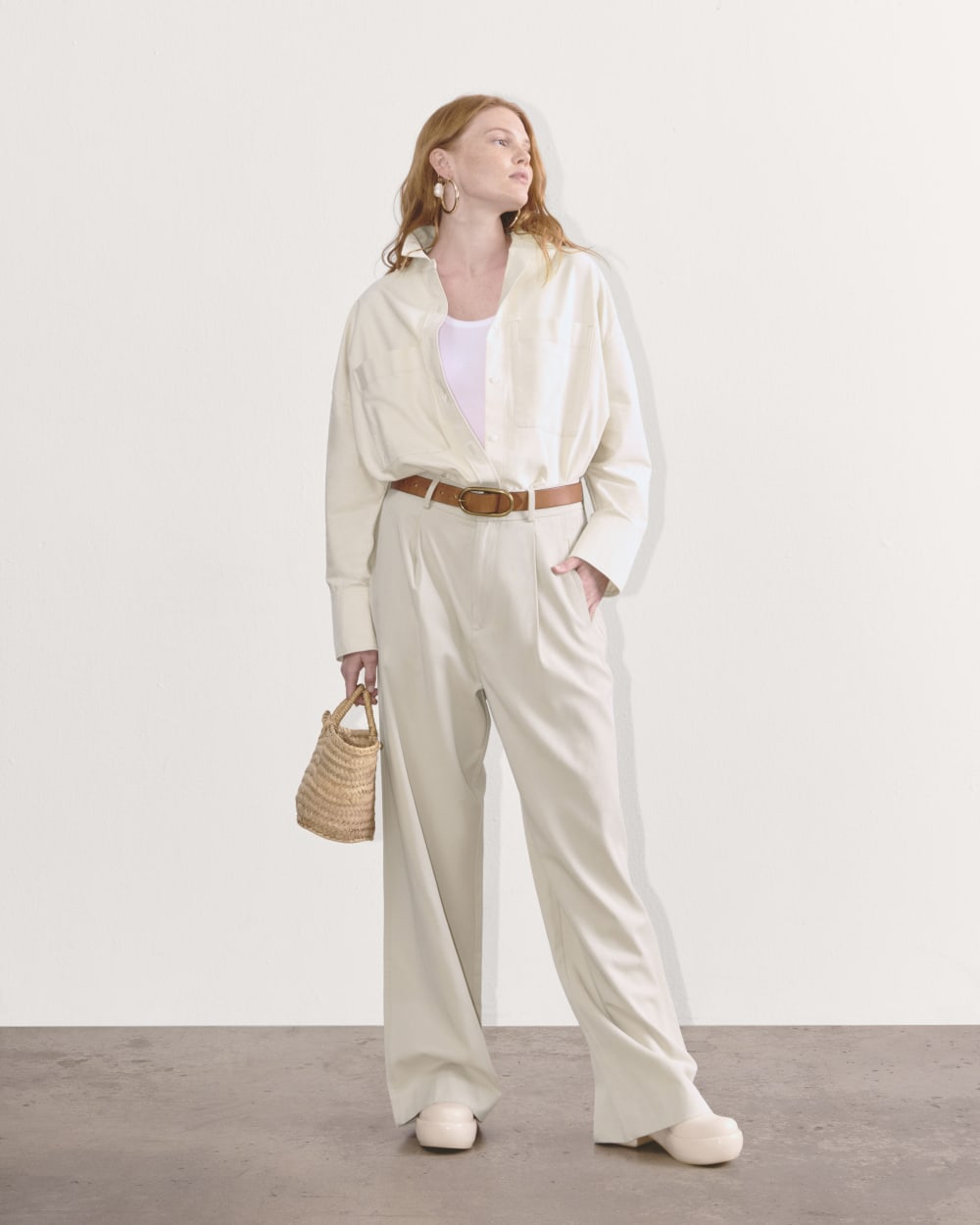 The Draper Pleated Pant in Buttersmooth in Sandstone — front view