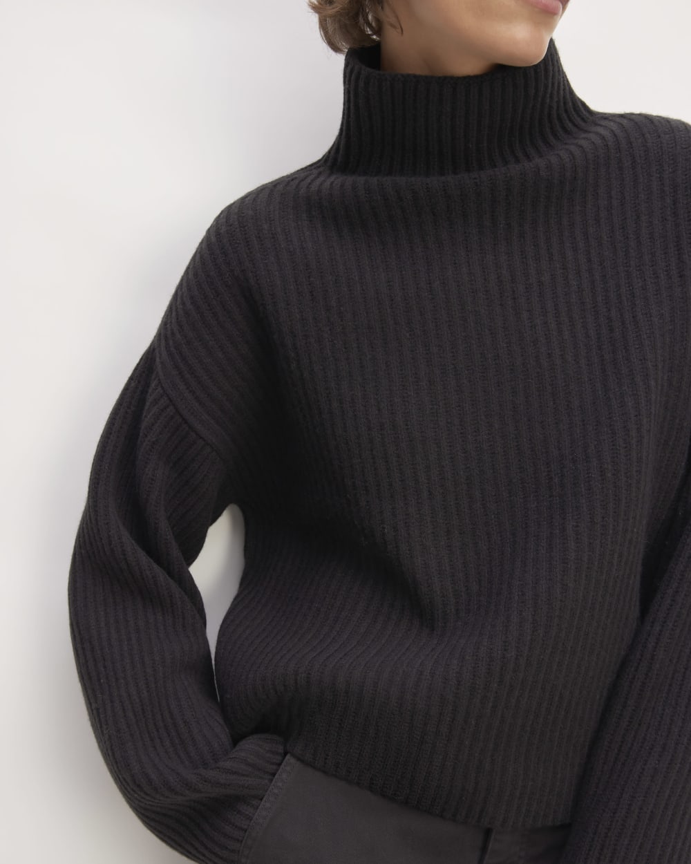 The Felted Merino Funnel-Neck Pullover in Black — detail view