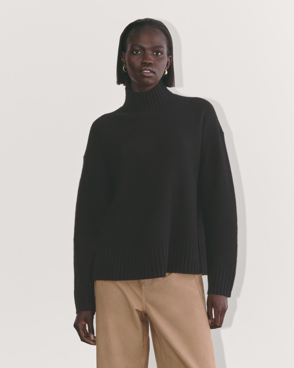 The Honeycomb Funnel Neck in Wool Cashmere in Black — front view