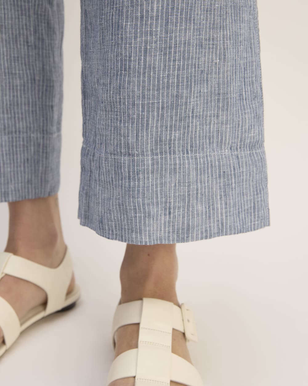 The Linen Side-Button Jumpsuit in White / Blue — detail view