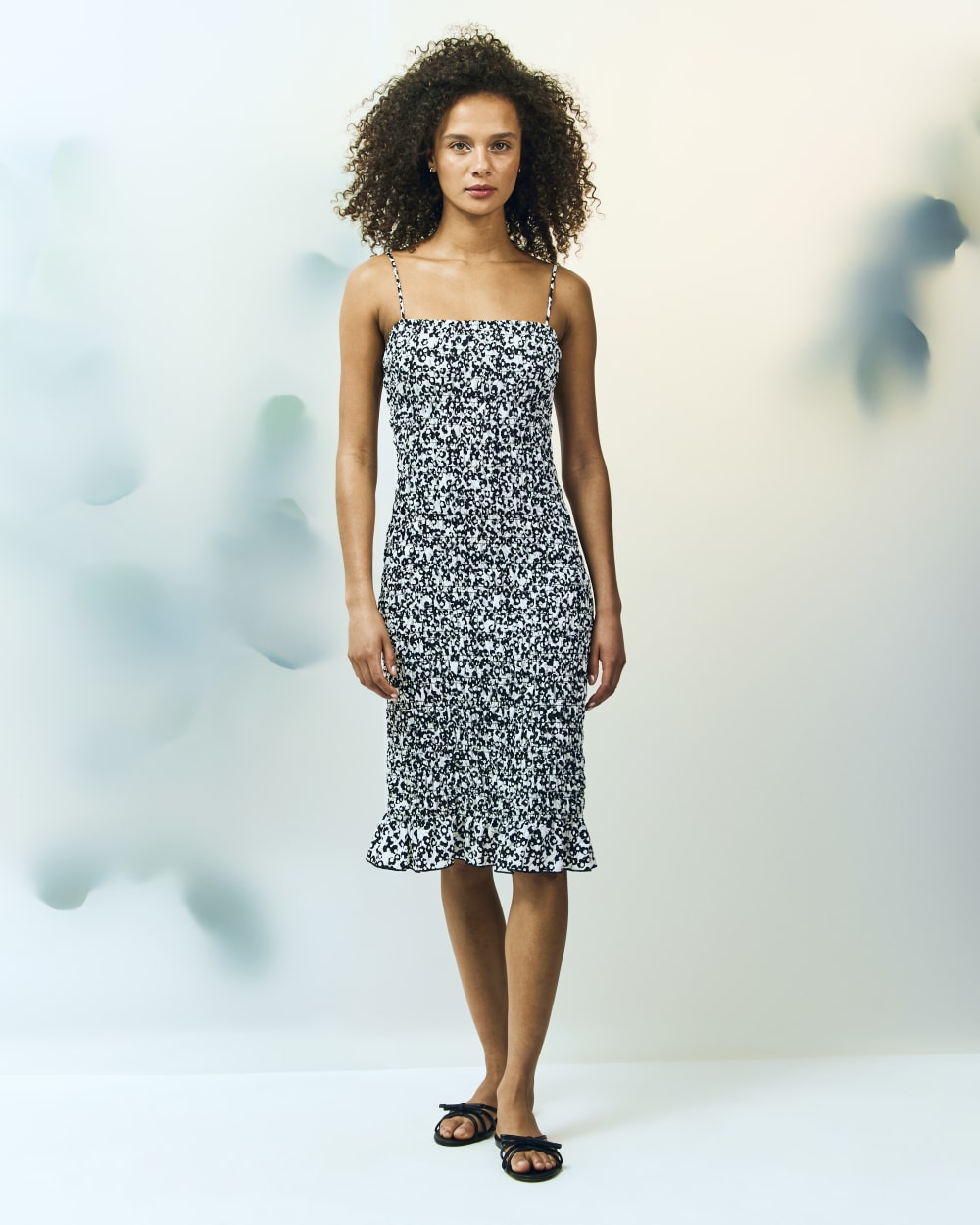 The Smocked Column Dress in Bone / Black Floral — detail view
