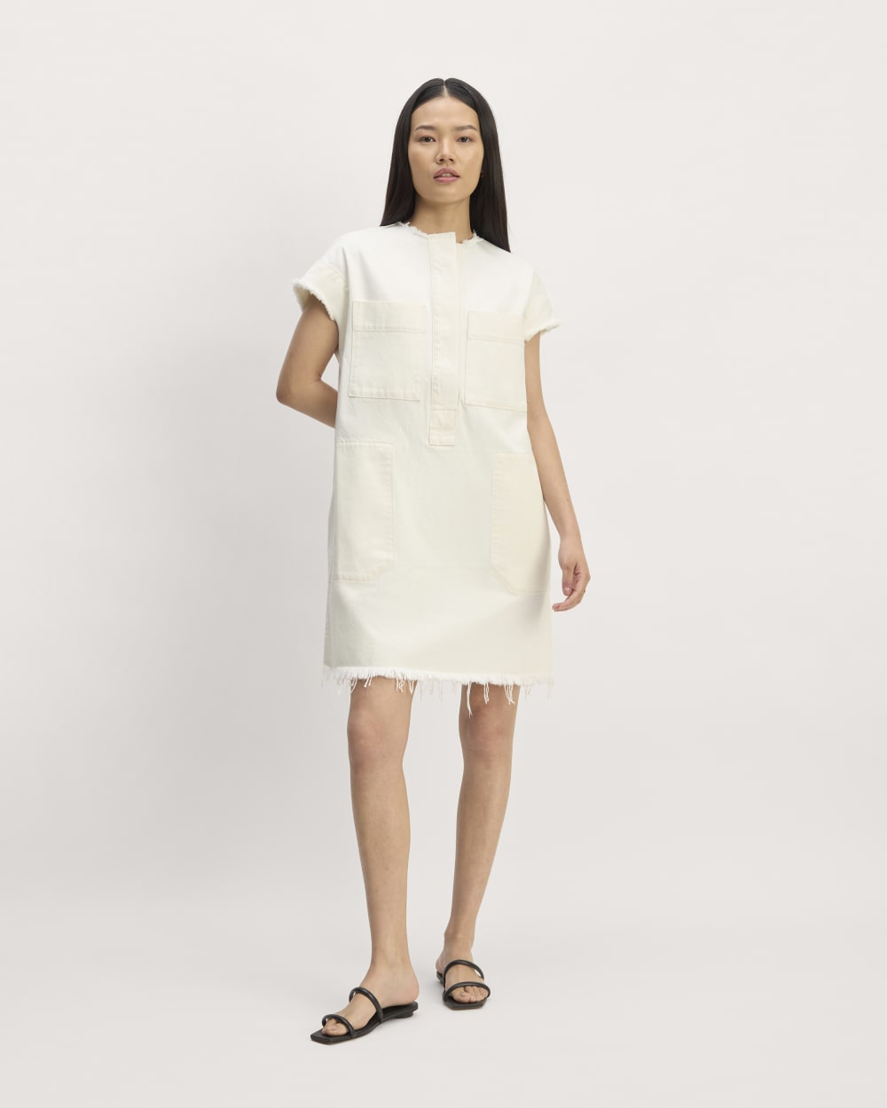 The Denim Workwear Shirtdress in Frayed Hem Bone — front view