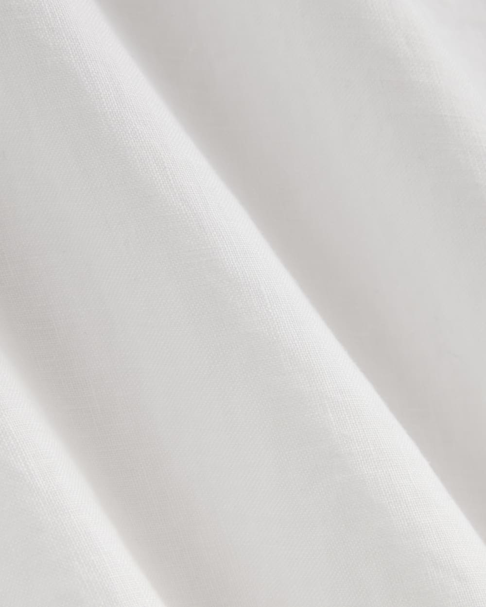 The Boatneck Top in Linen in White — detail view