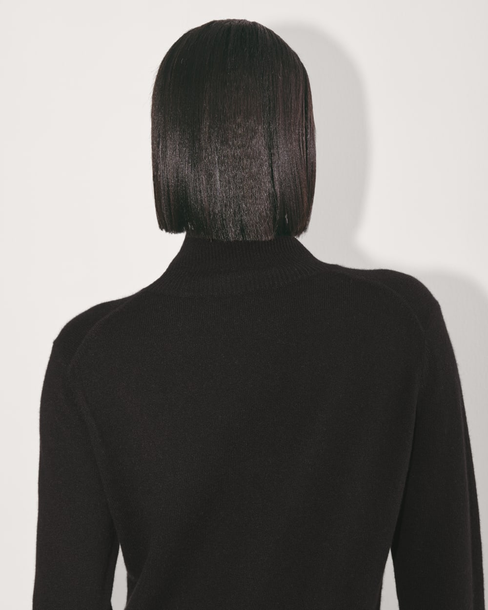 The Turtleneck Sweater Dress in Cashmere in Black — detail view