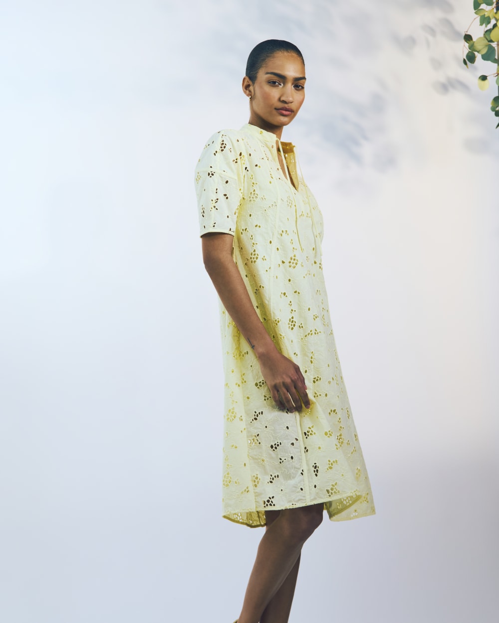 The Eyelet Midi Dress in Light Yellow — detail view