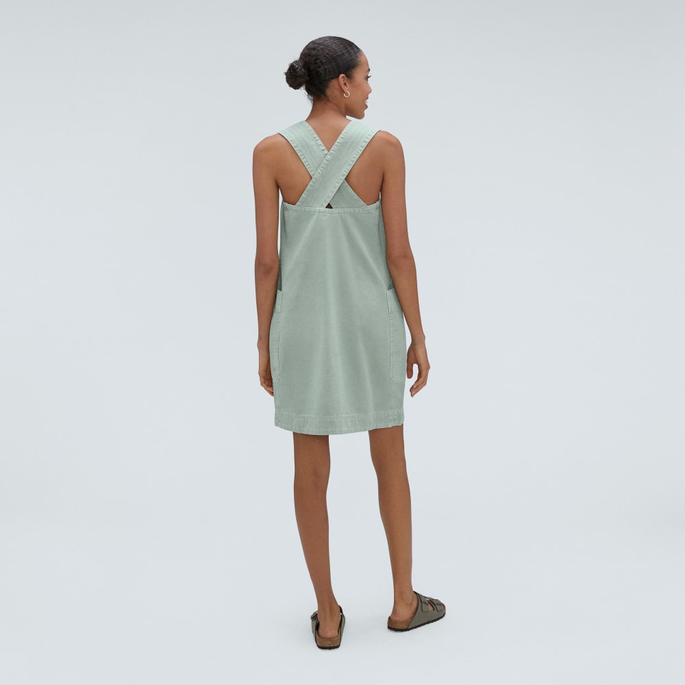 The Cross-Back Apron Mini Dress in Sea Glass — detail view