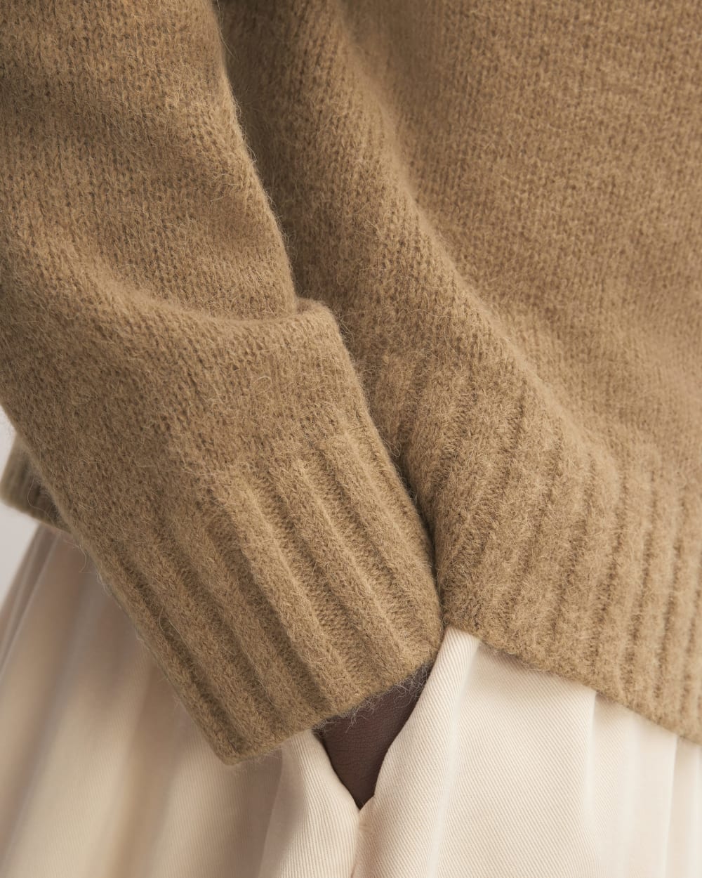 The Alpaca Cropped Crewneck Sweater in Tiger's Eye — detail view